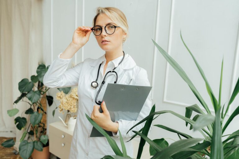 doctor wearing a eyeglasses and holding a clipboard